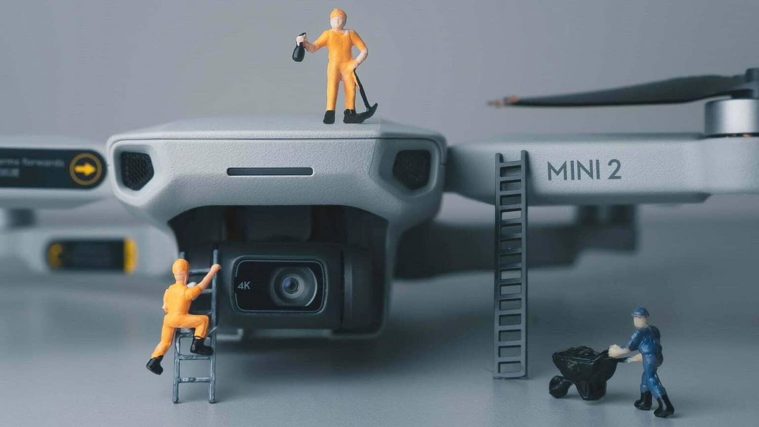 Plastic figurines climbing a drone